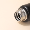 Close-up of thermos stainless steel bottle lid and mouth design