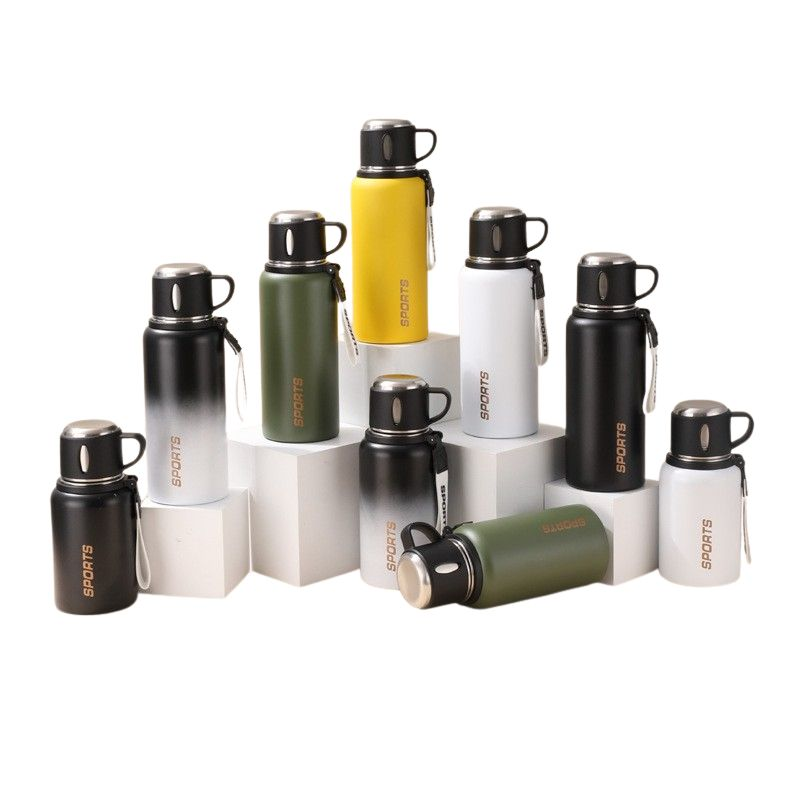 Thermos stainless steel bottles in all colours — green, yellow, gradient, black, and white, displayed together