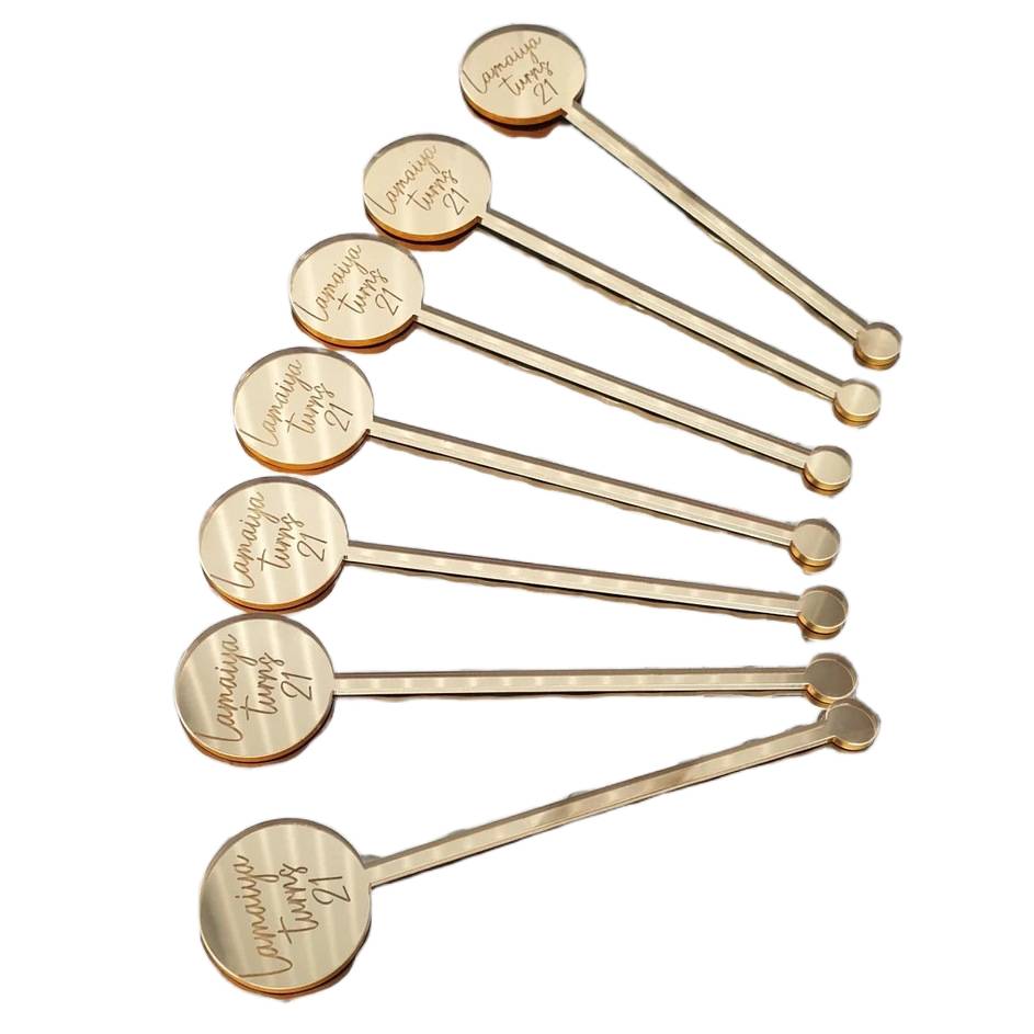 Custom drink stirrer used in cocktail glass for branding at event