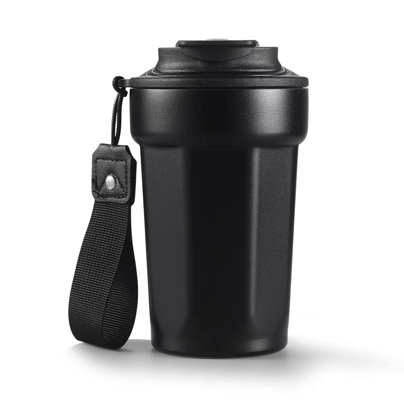 Modern octagonal coffee cup with carrying strap for travel