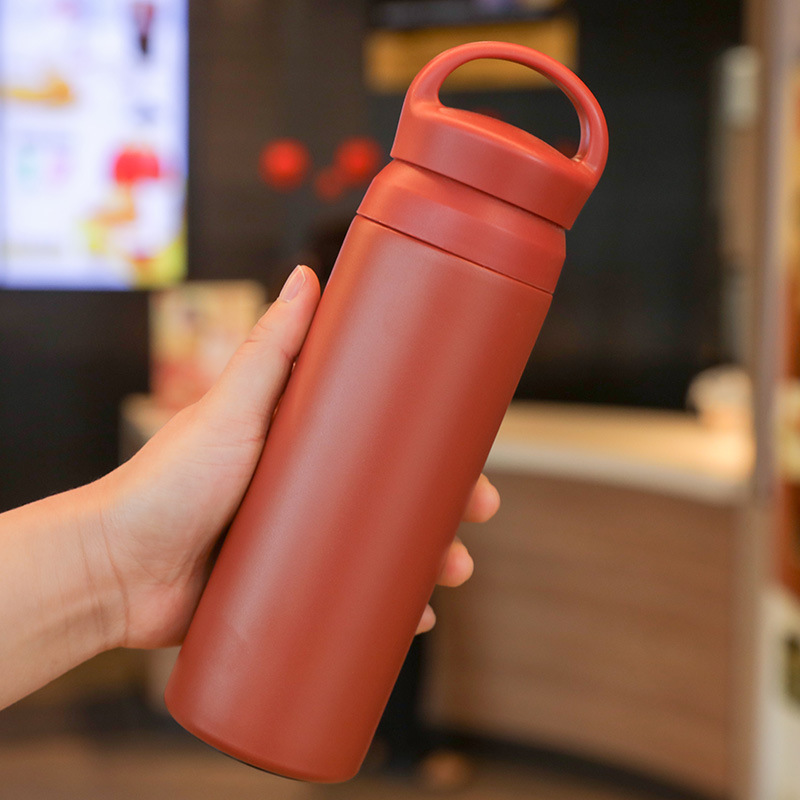 Red stainless steel thermos bottle with glossy finish