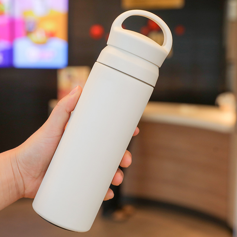 White stainless steel thermos bottle with minimalistic design