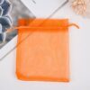 Orange drawstring mesh pouch