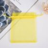 Yellow drawstring mesh pouch