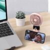 Handheld USB fan with built-in phone holder