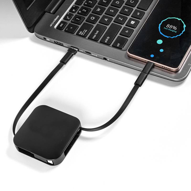 charging cable connected to laptop for power and data use