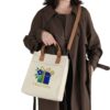 Canvas Shoulder Bag in Use Person Carrying Canvas Shoulder Bag