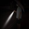 Umbrella flashlight in use at night